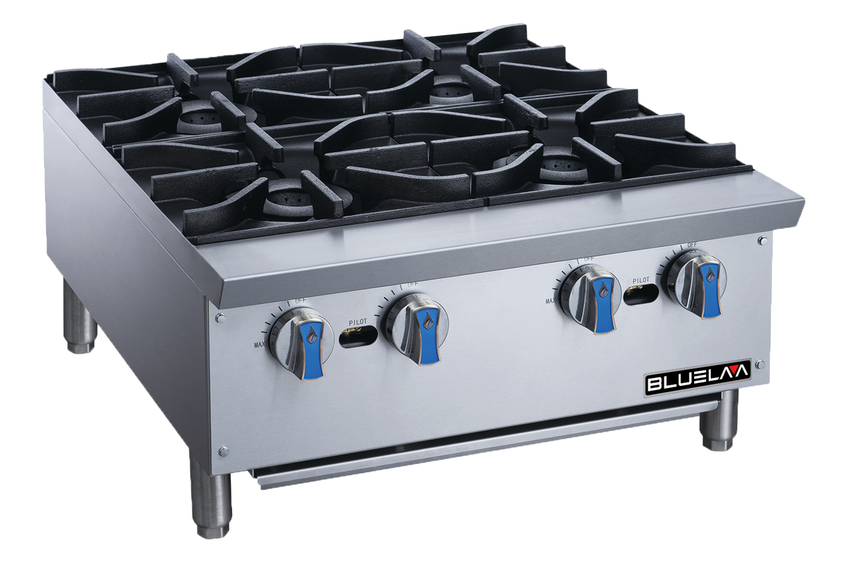 A stainless steel commercial gas stovetop with four burners, heavy cast iron grates, and blue-silver knobs rests on short metal legs. Ideal for countertop use, the clean “BLUELMA” unit stands against a plain background.