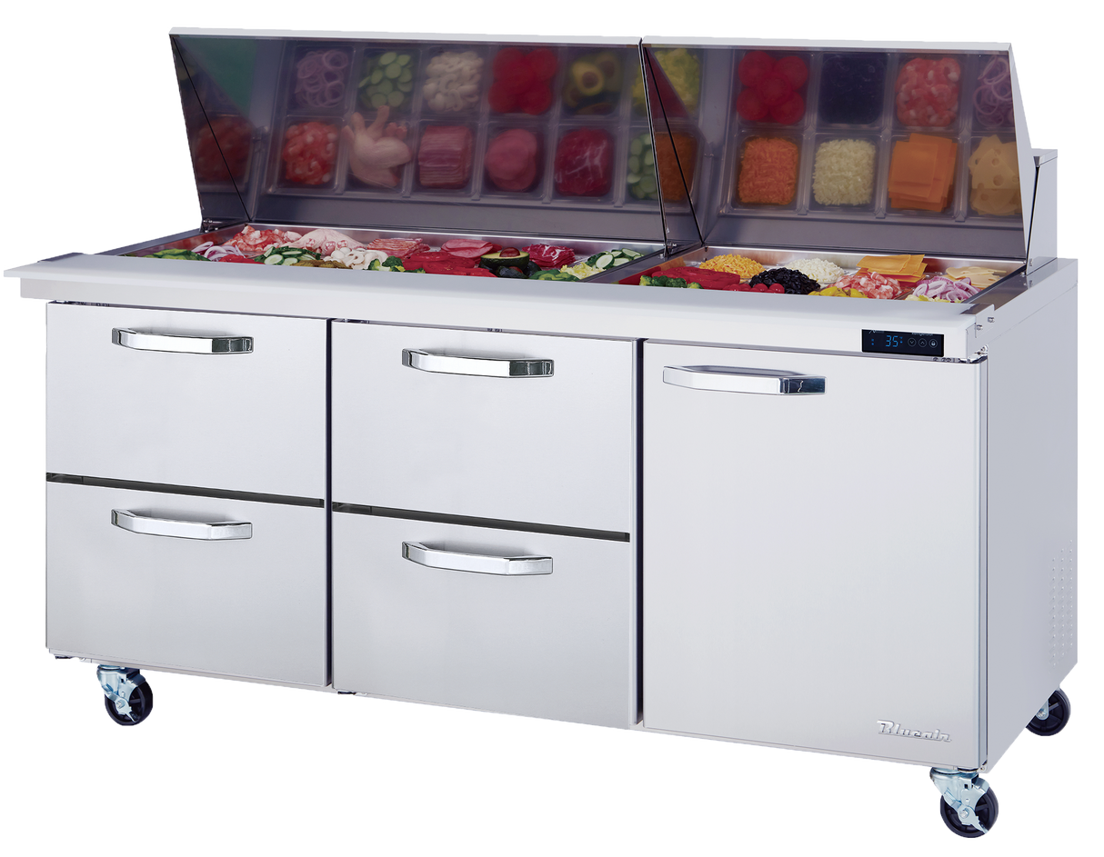 A stainless steel Mega Top Sandwich Prep Table with a glass lid open, revealing neatly arranged containers of sliced meats, vegetables, and cheeses. Below the prep area are three pull-out drawers and a door, all on wheels for mobility.
