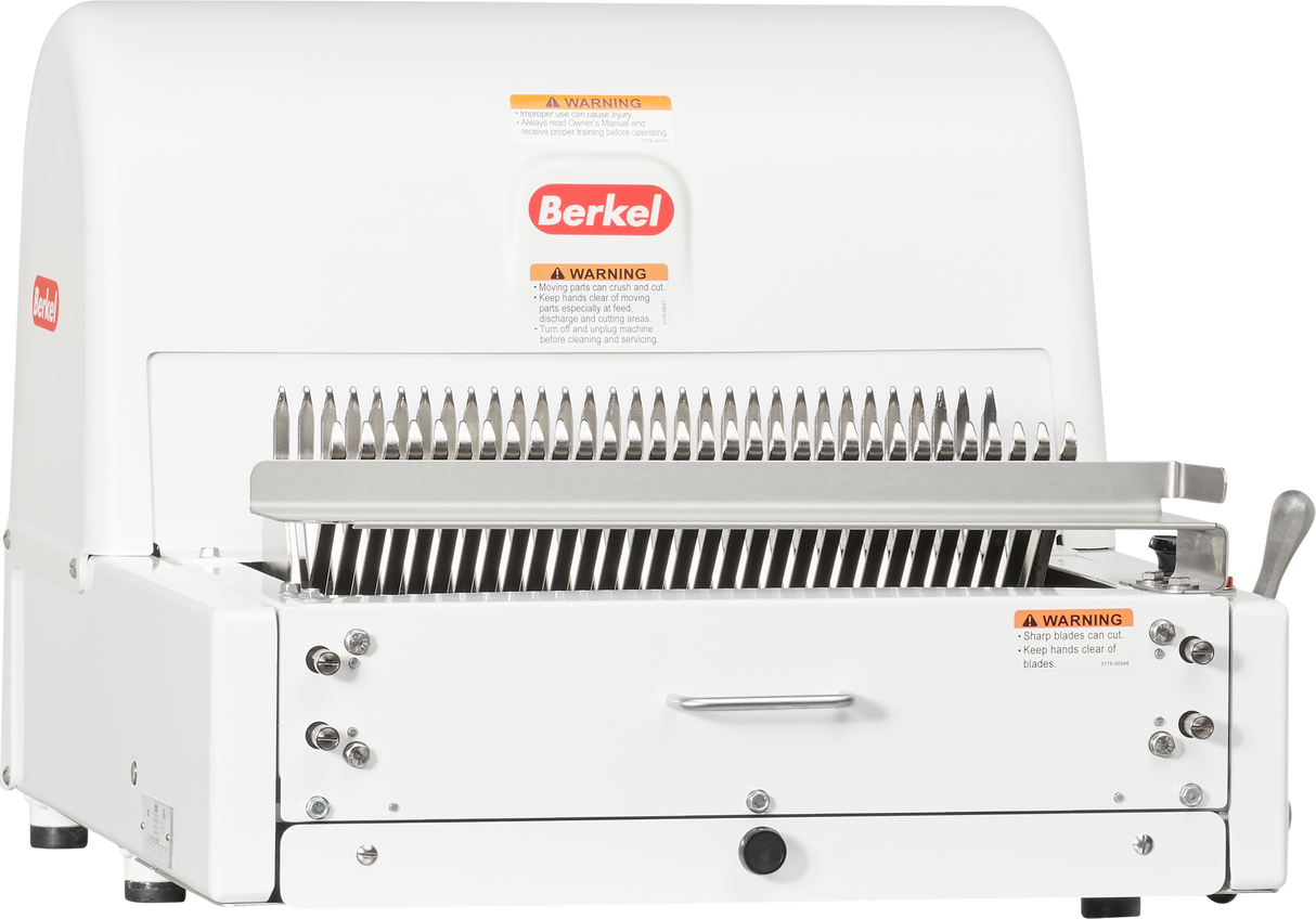 A Berkel MB1/2STD countertop bread slicer with a white metal body, multiple evenly spaced slicing blades, a right-side lever, and several orange warning labels. The “Berkel” logo is displayed at the top center of this Bread Slicer.