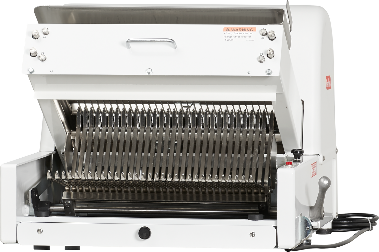 The Berkel MB1/2STD countertop bread slicer features a sturdy metal body, open front, and multiple parallel stainless steel blades. It includes a right-side lever, warning label on top, and a black power cord at the lower right.