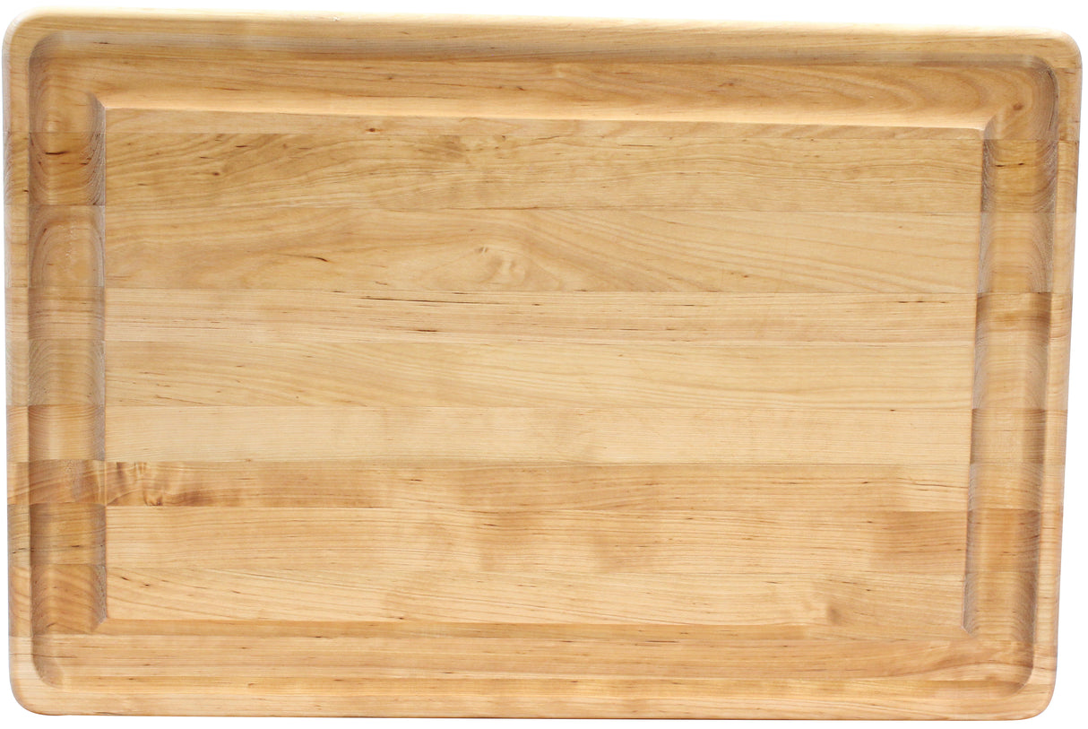 A large rectangular TableCraft carving board with a smooth, light natural wood finish. The board has rounded corners and a shallow groove running along the edge to catch liquids.