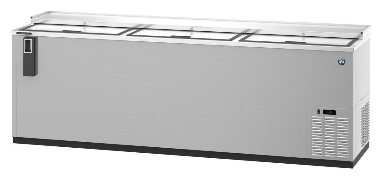 A large, stainless steel three-section commercial freezer with three sliding lids on top, a black handle on the left, ventilation grilles and a digital temperature display on the right, set against a plain white background. Ideal as a refrigerated bottle cooler.