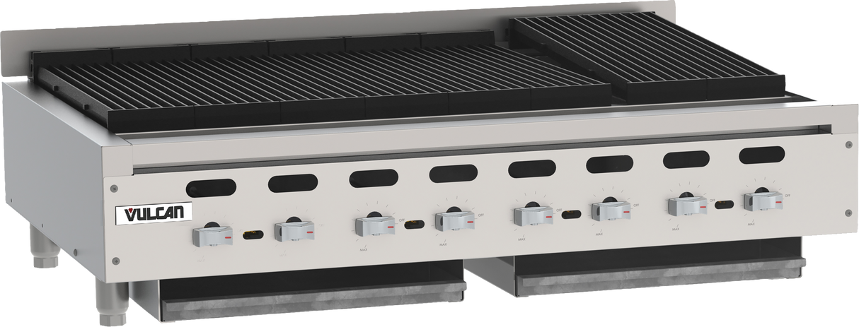 A commercial stainless steel Vulcan charbroiler with six control knobs, black grill grates, and two removable drip trays below. The countertop charbroiler features adjustable legs, a backsplash, and the Vulcan logo on the front left side.