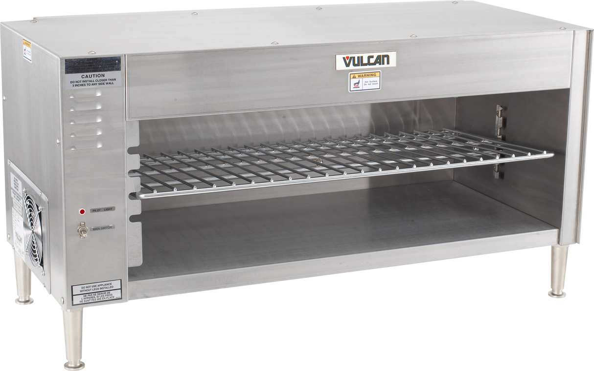 A commercial stainless steel Vulcan broiler with a quartz infrared heating element, wire cooking rack, open front, vent slots, side control panel, caution and brand labels, and sturdy legs—designed for professional kitchen use.