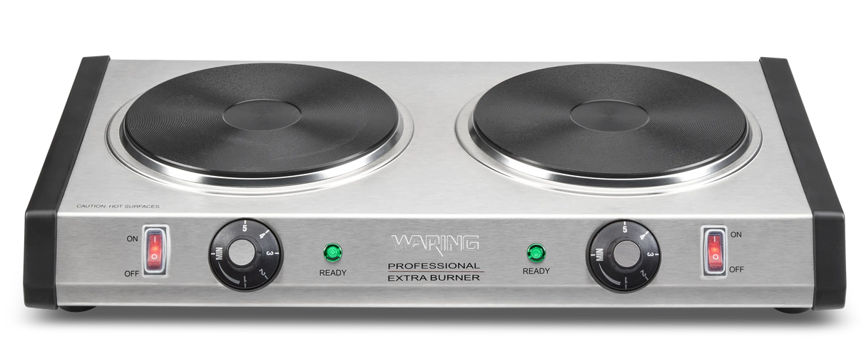 A heavy-duty stainless steel double-burner electric hot plate with two black cast iron burner plates, control knobs for heat settings, indicator lights, and “Waring Professional Extra Burner” labeled on the front panel.