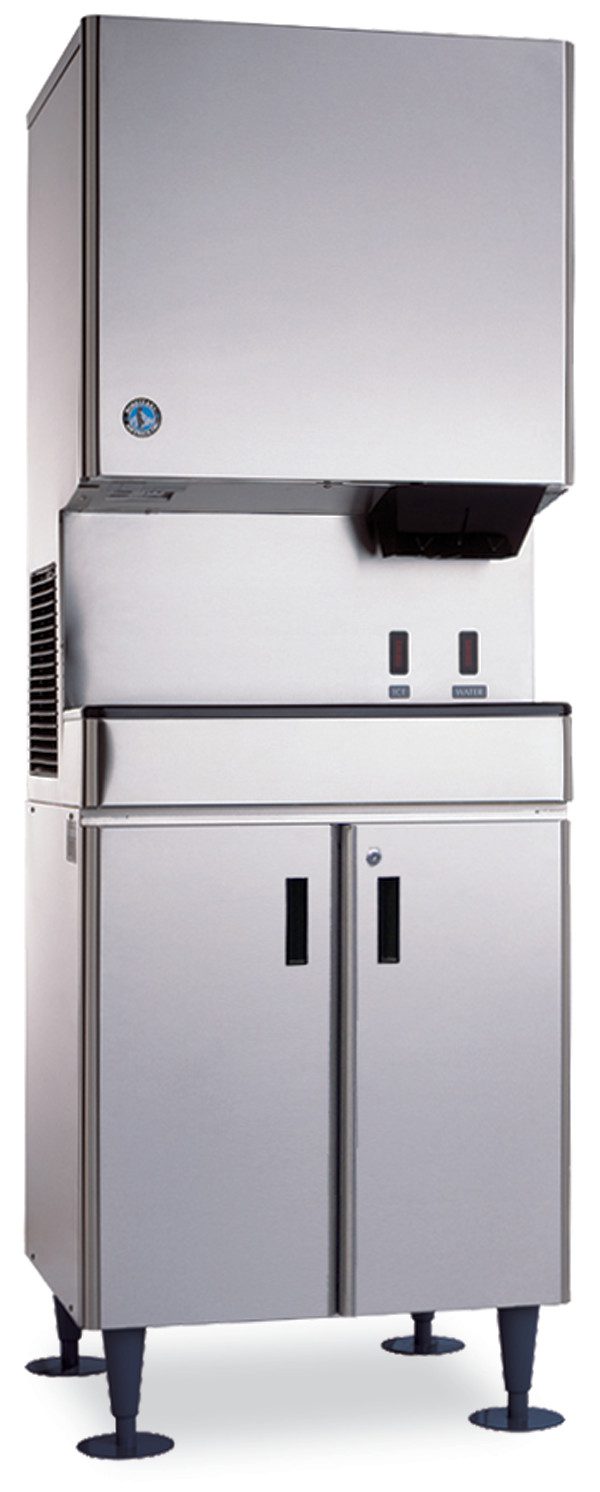 A tall, stainless steel commercial ice machine with a top Hoshizaki SD-500 ice dispenser, control buttons, and a lower double-door storage cabinet on four adjustable legs. This sleek icemaker equipment stand is perfect for kitchen or food service use.