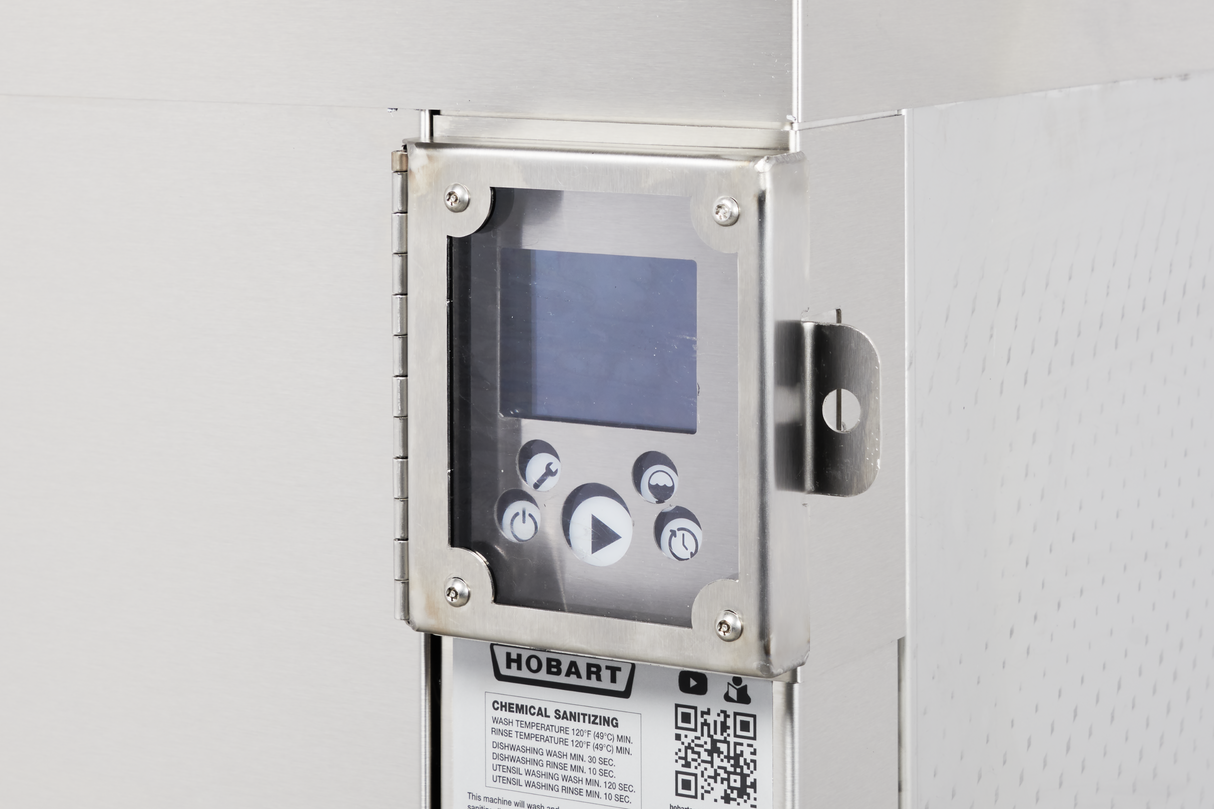 Close-up of a stainless steel commercial dishwasher control panel featuring a digital screen, four round buttons, and a play symbol. A Hobart label with a QR code and chemical sanitizing instructions appears beneath the display.