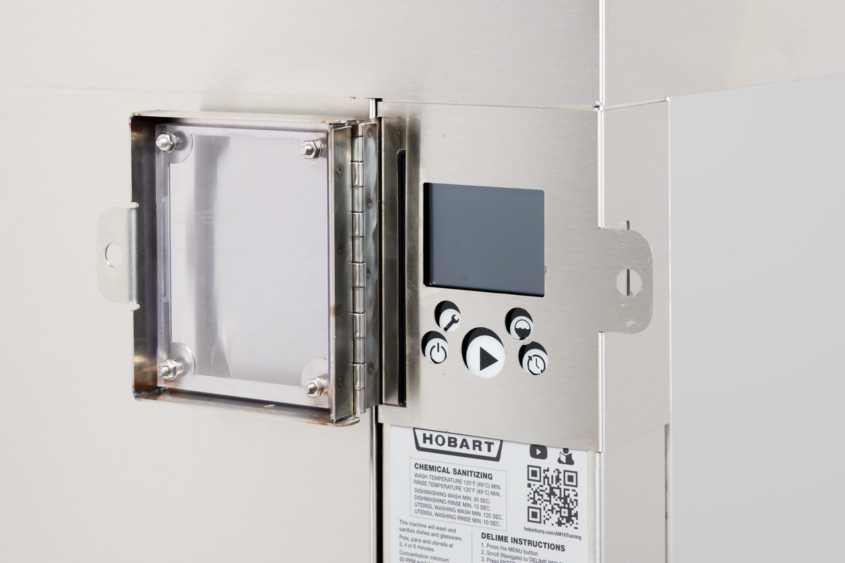 A close-up of a stainless steel Hobart commercial dishwasher control panel with a small display screen, four black-and-white buttons, a QR code, and a transparent protective cover hinged to the left. The shiny surface reflects the industrial design.