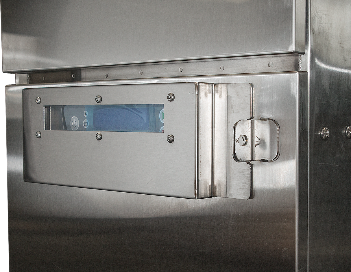 A close-up of a stainless steel machine panel on the Hobart FT1000E low energy flight type dish machine features a rectangular glass window, secured by screws and a latch. Blue components are visible inside, reflecting the ENERGY STAR industrial design.