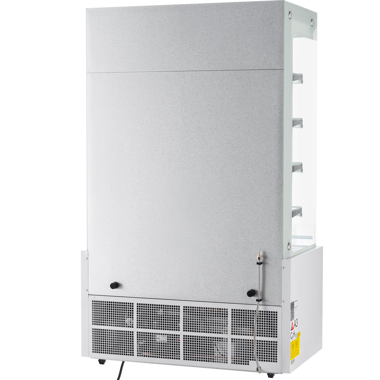 A commercial display refrigerator shown from the back, featuring a plain metallic panel, ventilation grilles at the bottom, power cord, and a yellow caution sticker. The right side reveals glass shelving and a transparent side panel.