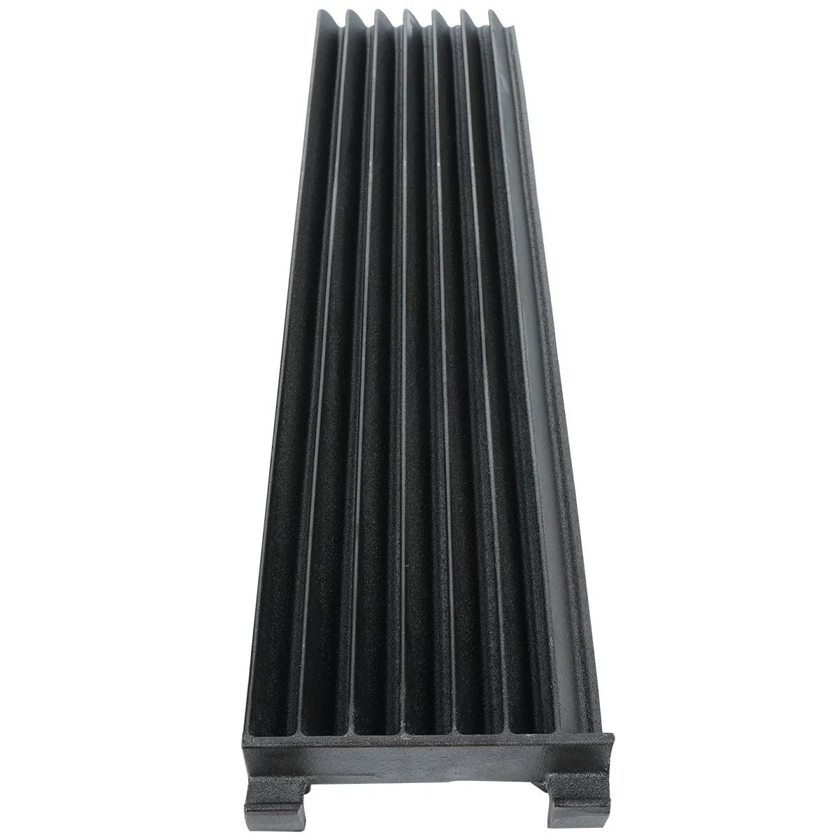 A black, rectangular plastic object with six deep, evenly spaced grooves runs lengthwise. Viewed from one end, its raised ridges and flat base resemble a cooking grate or component used in charbroilers, likely for industrial or kitchen use.