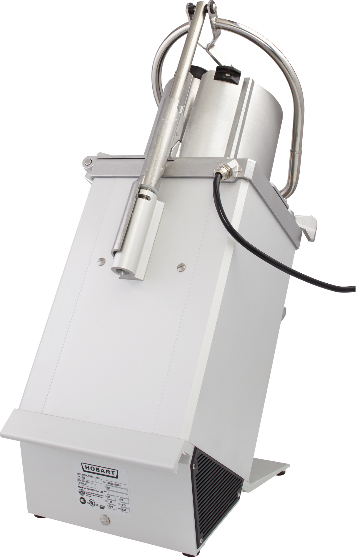 A silver and white Hobart food processor with a boxy stainless steel base is angled backward, displaying its chute, handle, black power cord, and control panel label. The machine features a cylindrical continuous feed tube on top.