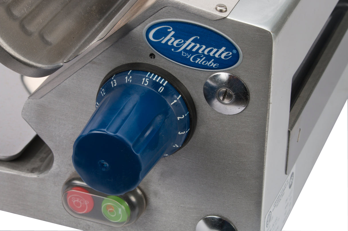 Close-up of a Chefmate Series compact slicer with a blue numbered dial from 0 to 15, two green and red buttons below, and a metallic finish. The Chefmate logo appears on a blue oval label above the dial—model Globe GC512.
