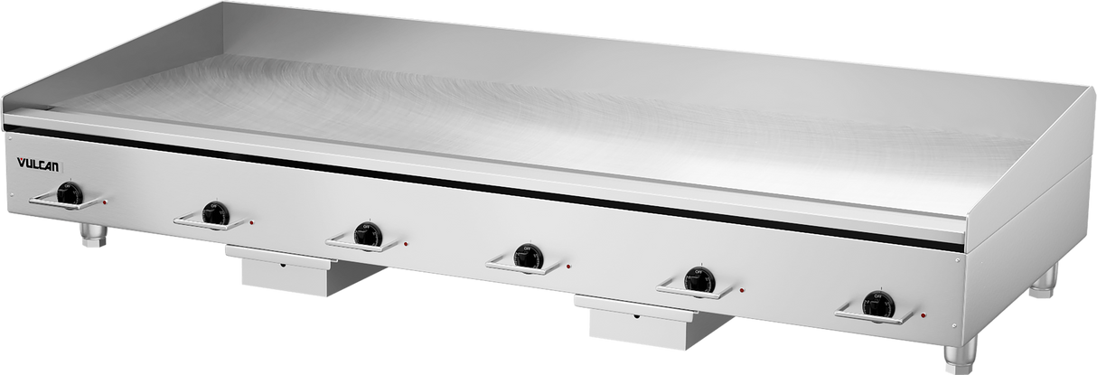 A large, stainless steel electric countertop griddle with six black control knobs along the front. The 72 inch heavy duty griddle features a flat cooking surface and minimalist design, with the brand name “Vulcan” on the left side.
