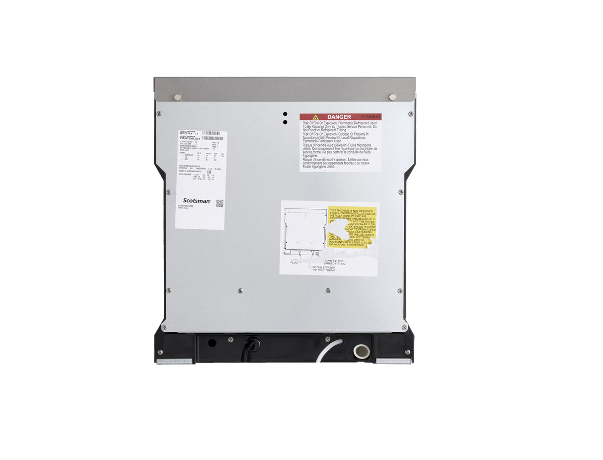 The image shows the back panel of a metallic appliance, likely a chewable ice machine. Product labels, a wiring diagram, warning stickers, and a vent at the bottom are visible. The plain white background emphasizes the appliance’s rectangular rear view.