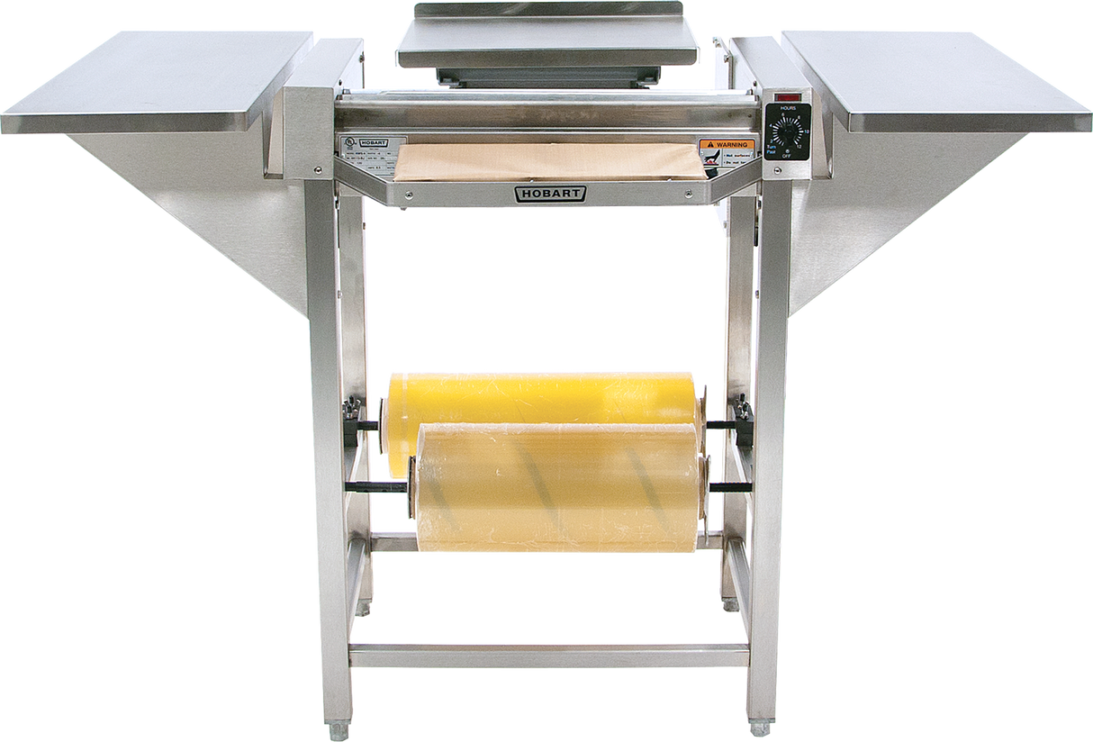 A Hobart Hand Wrap Station with 20 film capacity, featuring two side shelves, a control panel on the right, and two rolls of yellow food wrap mounted underneath. The unit is set against a plain white background.