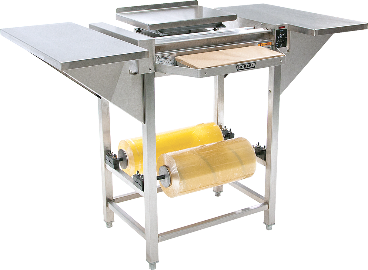 A Hobart commercial stainless steel Hand Wrap Station with a 20 film capacity features two rolls of yellow plastic film, a central sealing area, flat side trays, a cutting edge, and adjustable components for efficient food packaging.