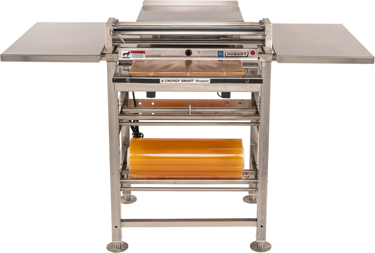 A Hobart-branded Energy Smart Hand Wrap Station with two metal side tables, roll film capacity for yellow plastic wrap underneath, and a rectangular heated seal plate in the center. The stainless steel frame stands on four round feet.