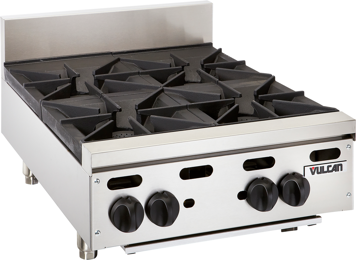 A commercial Vulcan countertop gas burner with four stainless steel burners, black cast iron grates, front control knobs, a small backsplash, and the “Vulcan” brand name displayed on the front right corner.