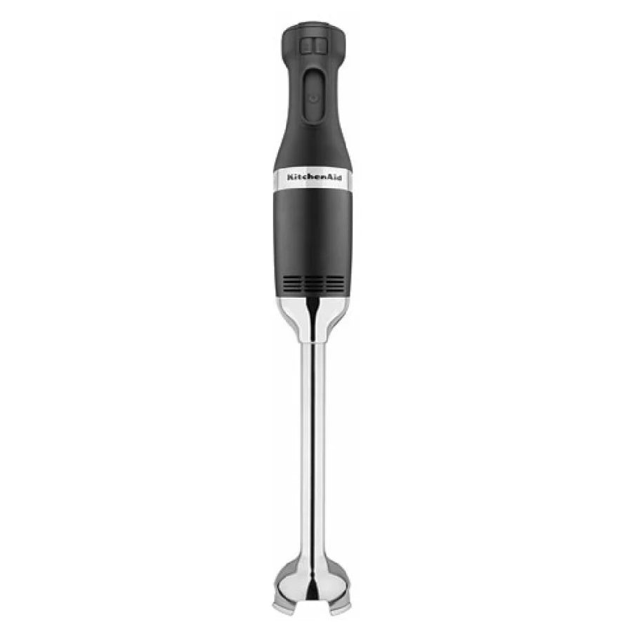 A black and silver KitchenAid Immersion Blender with a rounded handle, control buttons on top, and a stainless steel blending arm featuring a protective blade guard. The brand name KitchenAid is visible on the front of this heavy duty immersion blender.