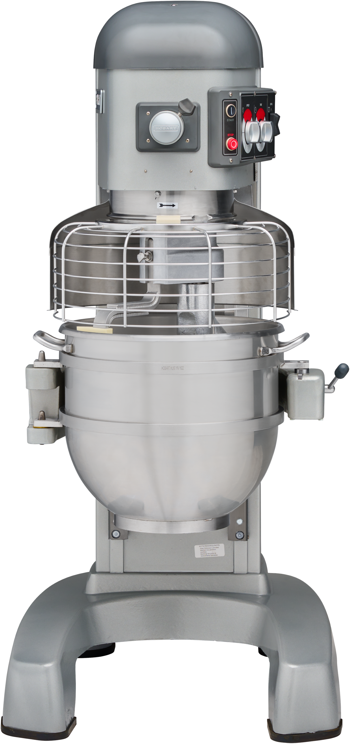 A large commercial planetary mixer with a metal mixing bowl, wire safety guard, control switches, and a sturdy base. The 60 quart mixer is silver and gray, with a lever on the side and buttons on the upper front panel.