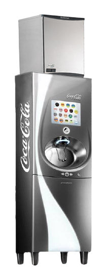 A silver Coca-Cola Freestyle soda fountain machine with a touchscreen interface displaying drink options. The machine features a single drink dispenser below the screen and an integrated commercial ice machine for chewable ice on top.