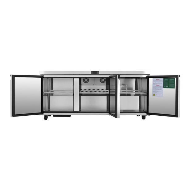 An Atosa AUR72SD commercial undercounter refrigerator with all three stainless steel doors open reveals empty shelves and storage compartments. The unit has caster wheels and documents attached inside the rightmost door.