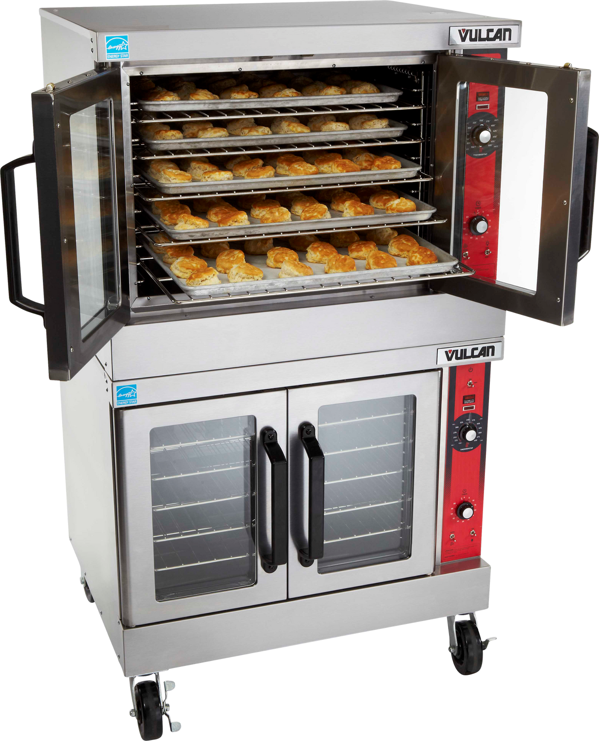 A commercial stainless steel Vulcan electric double-deck convection oven with an open top door reveals multiple trays of golden-brown pastries baking inside. The oven has control knobs, red panels, two glass doors below, and is on wheels for mobility.