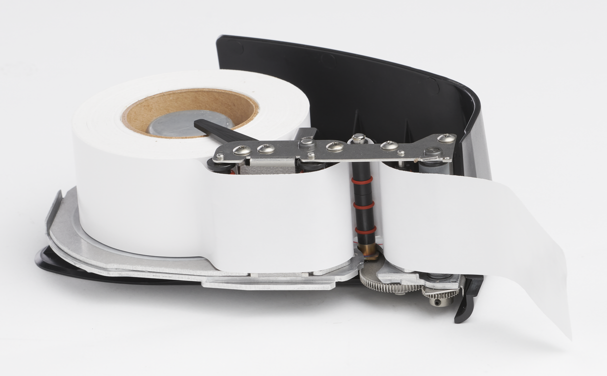 A close-up view of a Hobart HTi scale/printer thermal printer mechanism with an exposed black plastic cover, showing a white paper roll threaded through the printhead and rollers, all set against a plain white background.