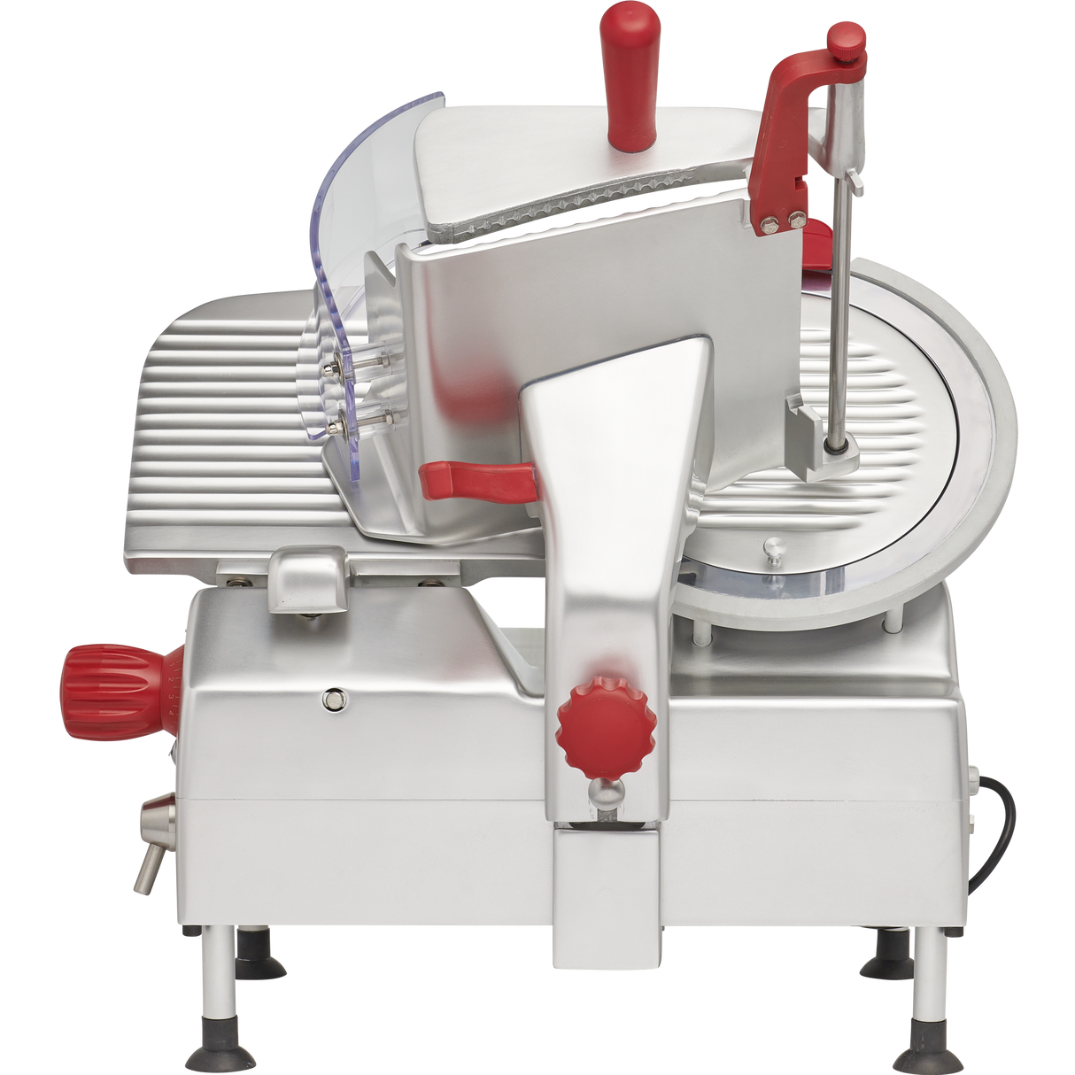 A commercial gravity feed slicer with a silver metallic body, red knobs and handles, a large 12 carbon steel knife on the right, a grooved food carriage on the left, and a transparent safety guard, standing on four small legs.