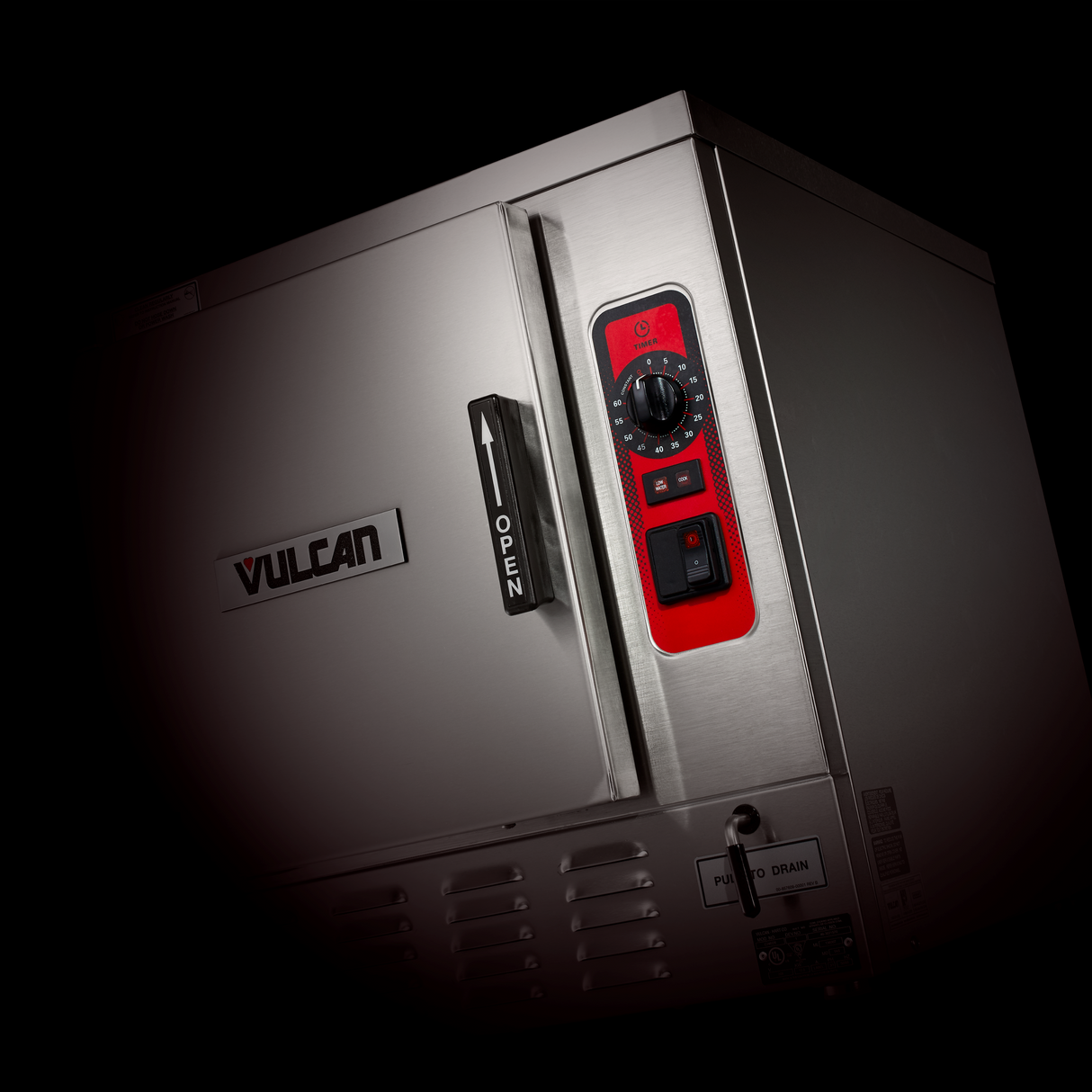 A stainless steel Vulcan boilerless countertop steamer with a door marked OPEN, black handle, and red control panel featuring a dial, button, and indicators sits against a black background.