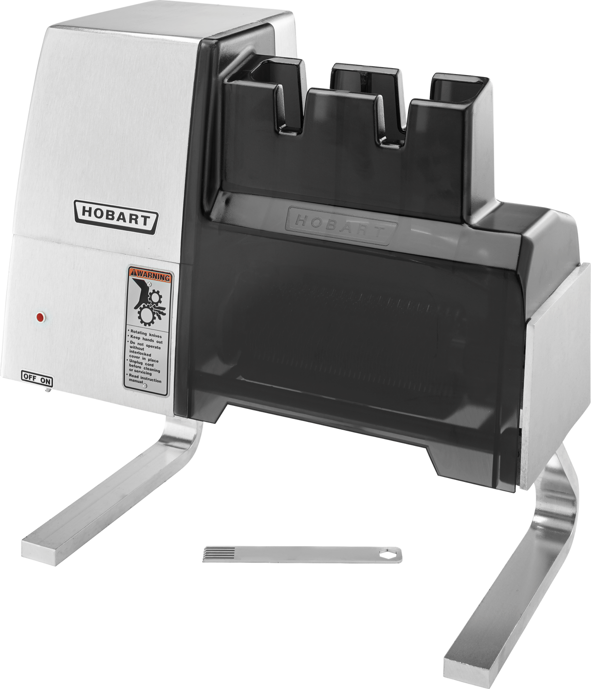 A stainless steel Hobart 403-1 electric knife sharpener with two angled metal legs, black top cover, warning label, indicator light, and a small metal tool placed in front. Features two sharpening slots and US export configuration voltage specification.