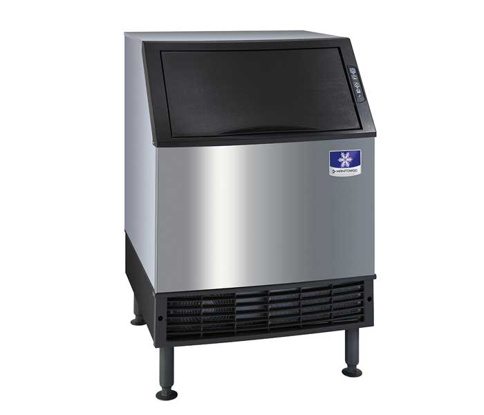 A commercial undercounter ice maker with a stainless steel body, black vented front panel, and black lid. Featuring four adjustable legs and a blue Manitowoc NEO logo with a white snowflake, the air-cooled ice makers control panel sits on the top right corner.