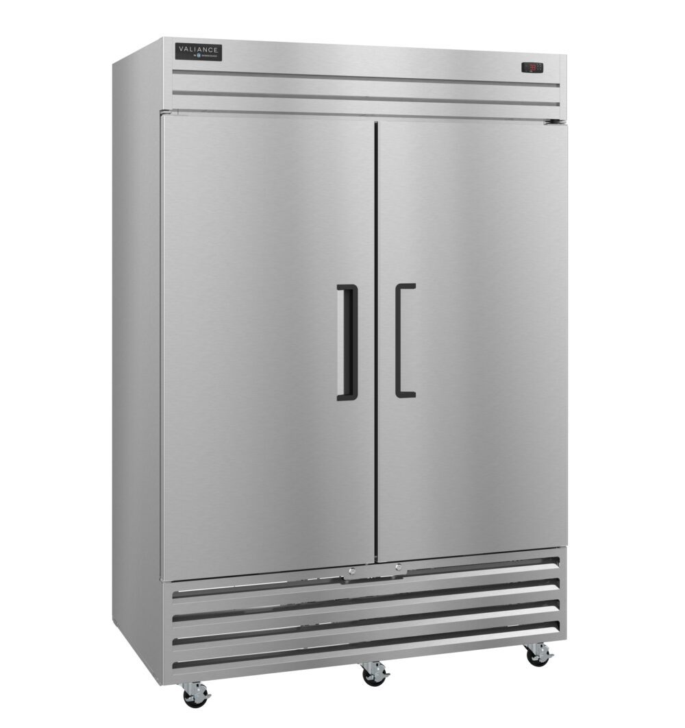 A large, commercial stainless steel double-door Valiance Series Freezer with black handles, vents at the bottom, small wheels for mobility, and a digital display on the top right. Its smooth, reflective surface features a rectangular brand label at the top left.