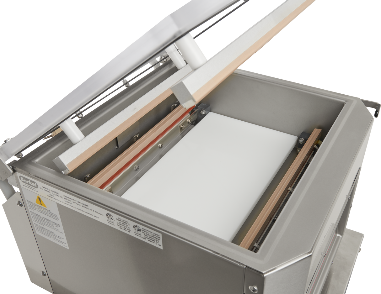 The Berkel 350D-STD Single Chamber Vacuum Packaging Machine features a white sheet inside for efficient and secure packaging.