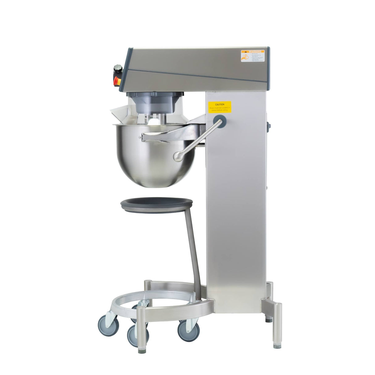 A Varimixer KODIAK 20 qt. Food Mixer with a large stainless steel mixing bowl is mounted on a tall, sturdy metal frame with wheels for mobility. The mixer head features controls and safety labels, with a black circular platform below the bowl. The background is white.