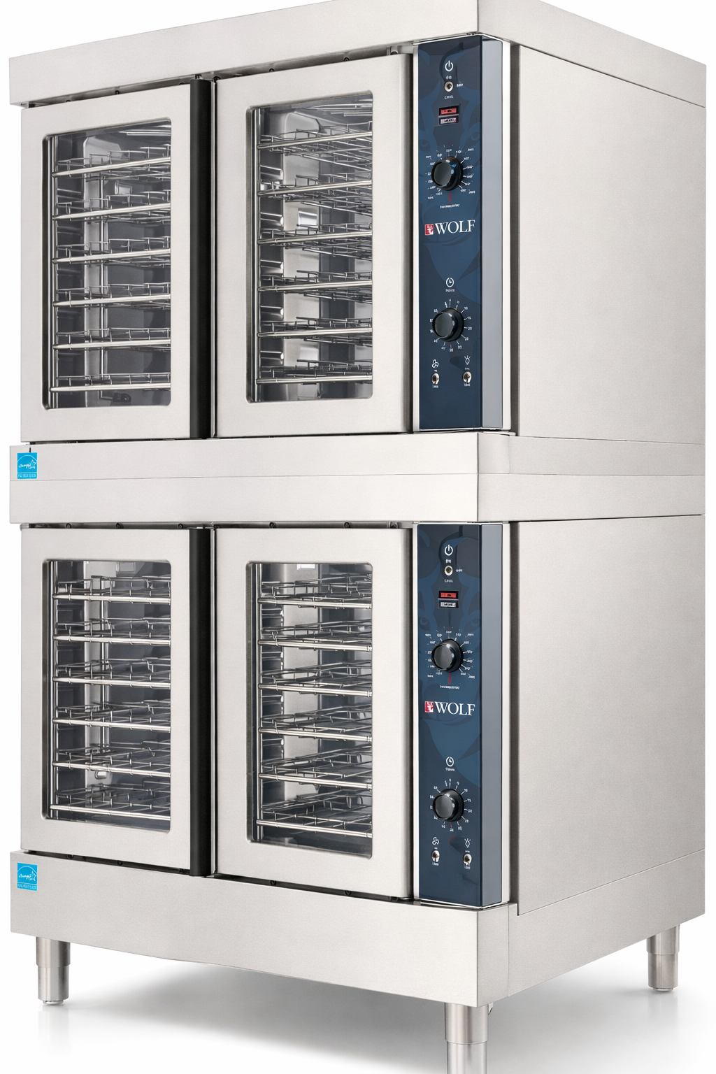 This double-deck commercial convection oven features four glass doors, a stainless steel exterior, multiple wire racks in each compartment, and a Wolf logo on the control panel. The unit stands sturdy on metal legs.