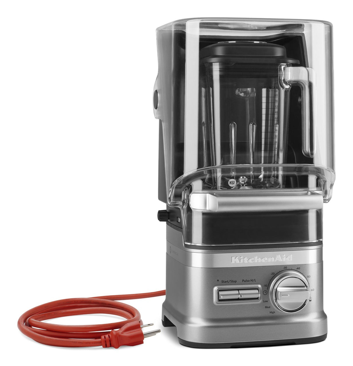 A silver KitchenAid Commercial Blender with a 60 oz. capacity and a clear plastic cover sits on the counter. An orange power cord is coiled beside the sturdy base, while labeled buttons add to its modern, professional design.