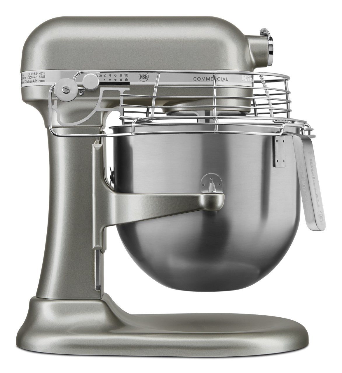 A metallic KitchenAid Commercial Stand Mixer features an 8 quart bowl, a wire guard on top, tilt-head design, and control dial on the side. It sits on a wide, sturdy base with a commercial label visible on the upper arm.