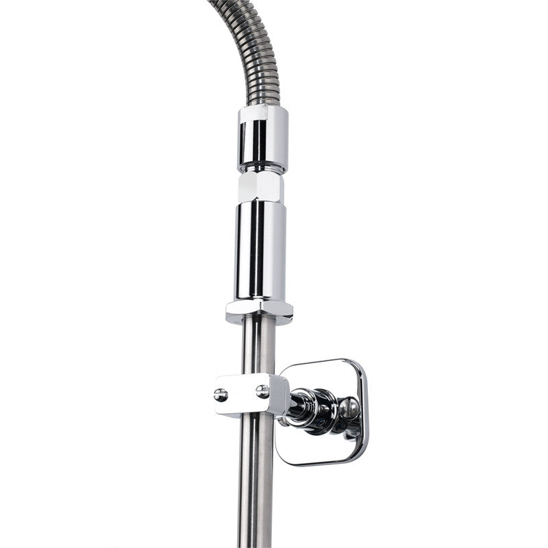 Close-up of a modern chrome shower fixture featuring a flexible hose, cylindrical connector, and wall-mount bracket attached to a vertical rod. The sleek, metallic design is reflective and highlights the fixture’s contemporary pre-rinse assembly style.