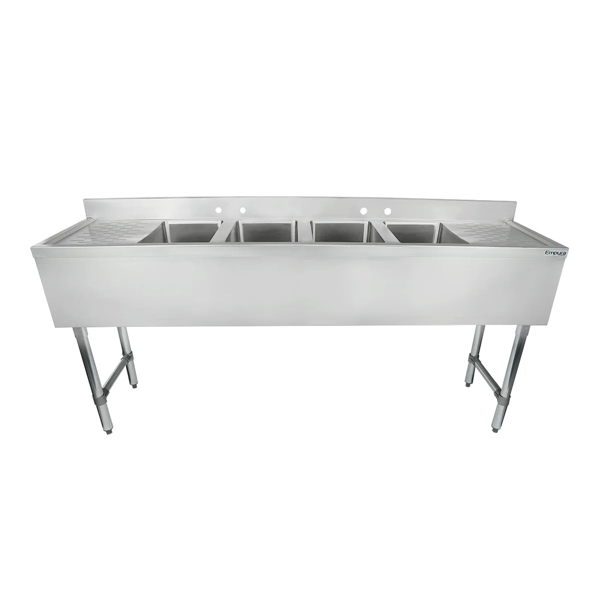 A commercial-grade 4 compartment stainless steel sink with deep rectangular basins and tall legs, designed for heavy-duty kitchen use. Features a raised backsplash with faucet holes and a flat counter area around the basins.