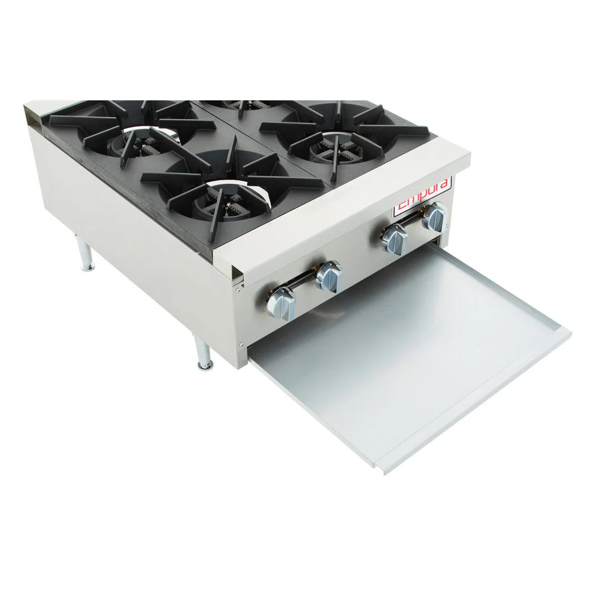 A heavy duty gas hot plate, this stainless steel commercial countertop stove features four black cast iron burners, two control knobs, an open pull-out metal drip tray below the controls, four sturdy legs, and a simple, industrial design.
