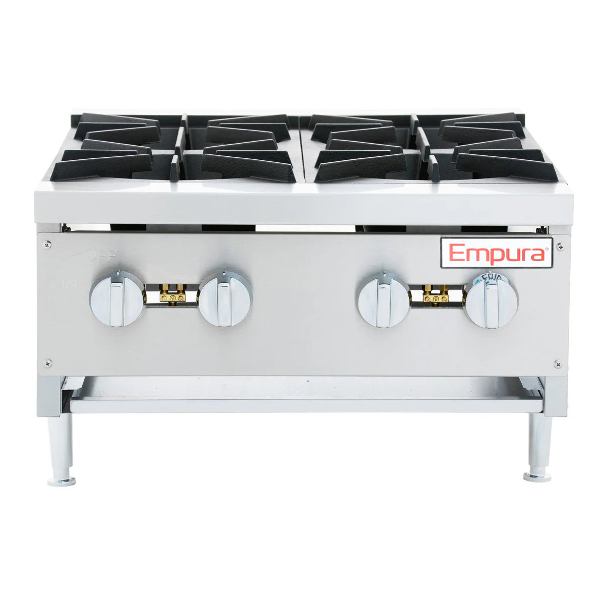 The Empura hot plate is a heavy duty gas hot plate featuring four black cast iron burners, two large silver control knobs per side, and the brand name Empura on the front. This countertop gas hot plate stands on sturdy metal legs against a white background.