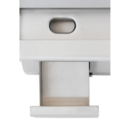 A close-up of an Empura E-GRID-24 stainless steel griddle shows a metallic device with a rectangular pull-out drawer partially open at the bottom. Above the drawer is an oval-shaped recessed handle, set in a smooth, brushed metal finish.