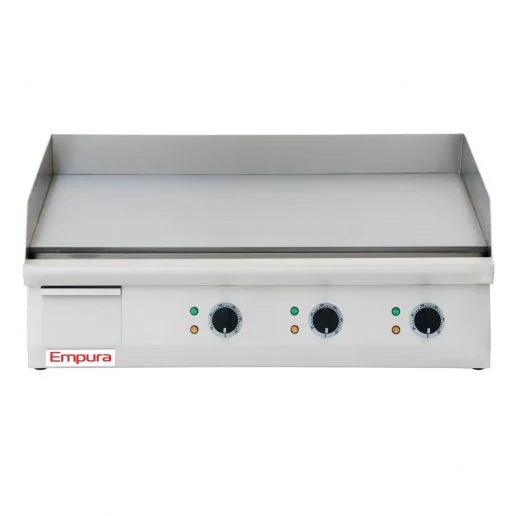 A stainless steel Empura countertop electric griddle with three control knobs and indicator lights on the front panel, a flat cooking surface, and raised sides and back for splatter protection. The Empura brand is visible on the lower left corner.