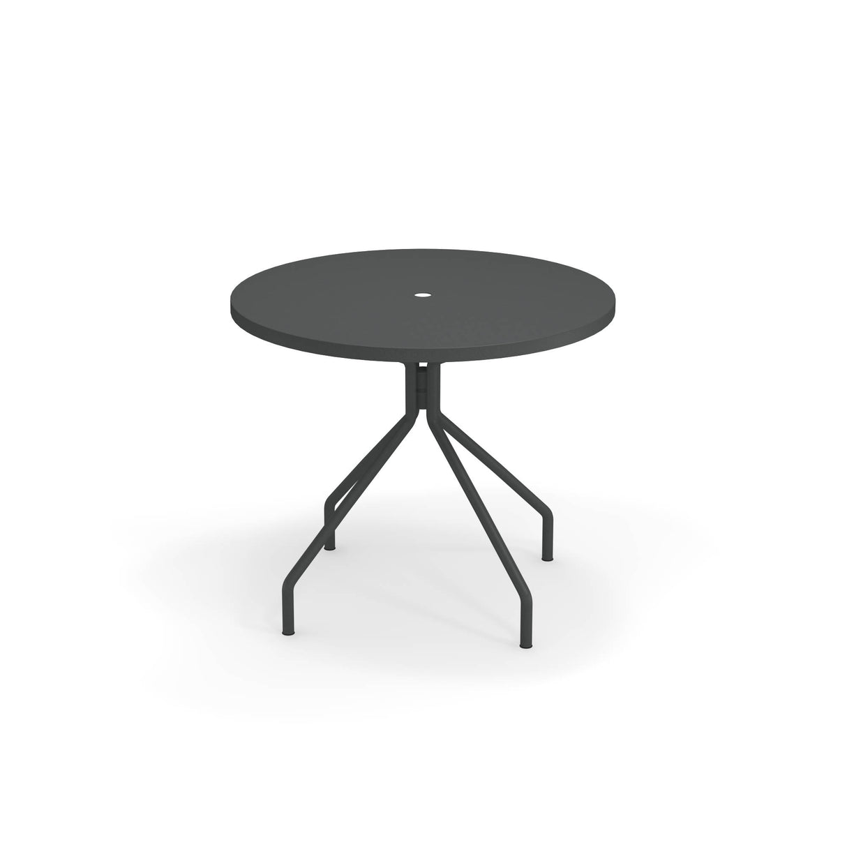 A round, black solid steel table with a central hole for an umbrella. Made in Italy, it features four angled legs that converge at the center and extend outward, creating a modern, minimalist outdoor/indoor table. The background is plain white.