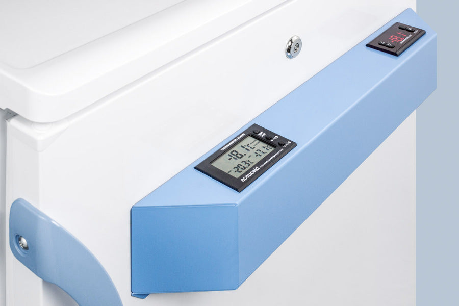 Close-up of an Accucold Medical Freezer door with a digital control panel, displaying temperatures in Celsius on LCD screens. This NIST Calibrated undercounter all-freezer features precise temperature readings, control buttons, and a lock on the panel. A blue handle is positioned on the left side of the freezer.