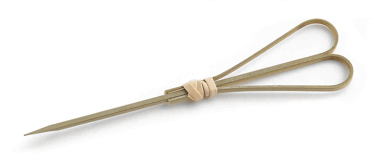 A pair of scissors made from unfinished metal, with both handles and blades open. Fastened with a beige rubber band instead of a screw, they have a makeshift look—almost as if held together by a simple bamboo pick. The background is plain white.