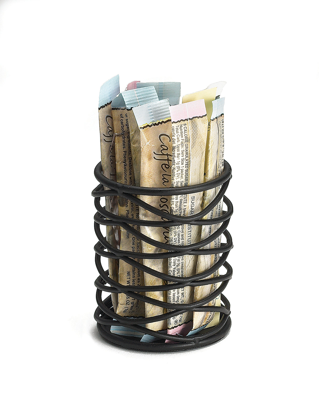A black metal spiral Artisan Collection holder contains multiple single-serve coffee stick packets in various pastel-colored wrappers, standing upright on a plain white background.