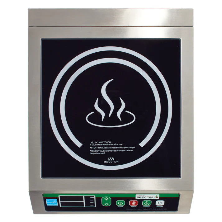 A top-down view of a commercial induction cooker with a stainless steel body, featuring a black surface, circular white markings, and a steaming bowl icon in the center. Control buttons and a digital display are on the front panel.